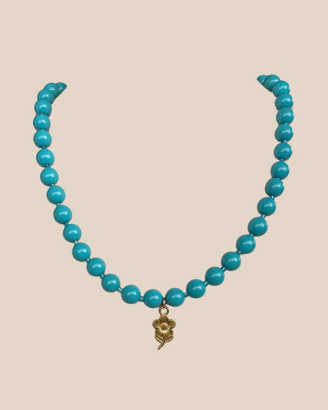 Ave Necklace: Turquesa con Charm de Flor en Stainless Steel